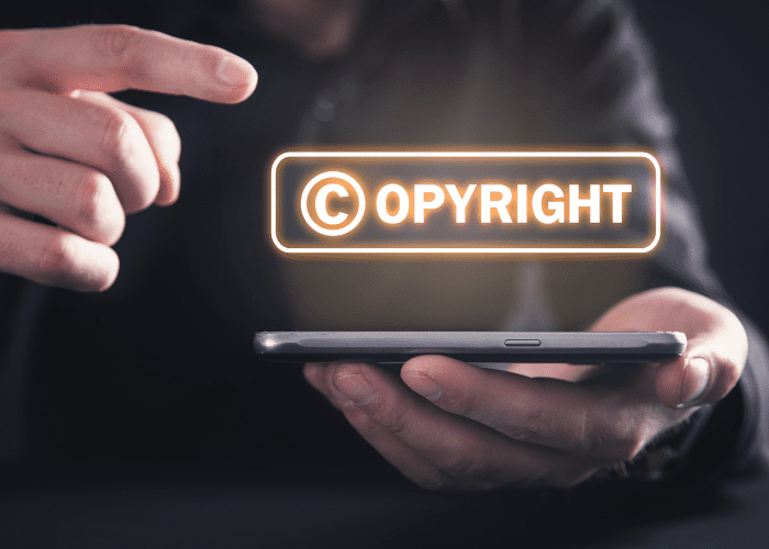hologram of copyright text over smartphone